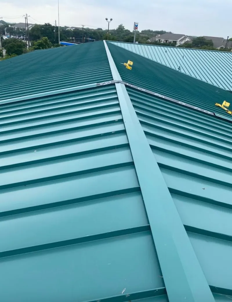 Green commercial metal roof ridge and valley for Metal Roof Repair in Merrifield